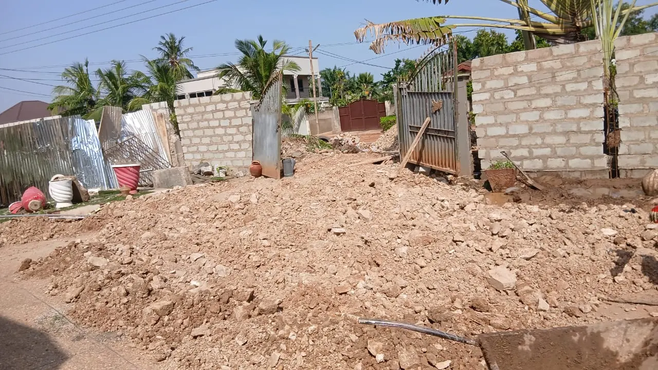 Open construction plot with boundary wall