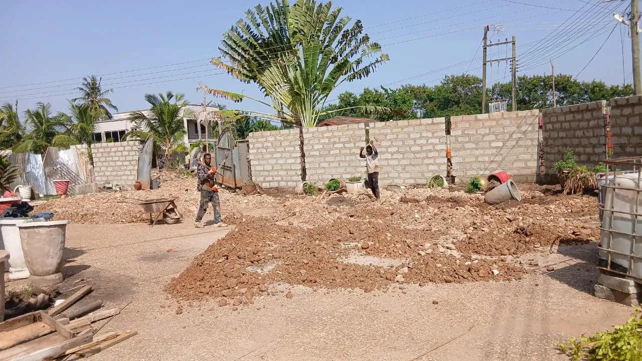 Workers preparing construction ground