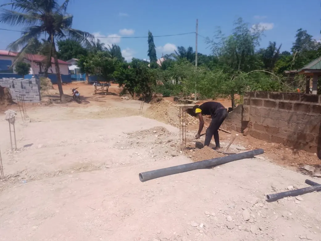 Worker preparing a construction foundation area